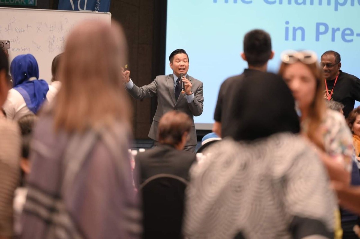 Mikael Chew speaking to a crowd