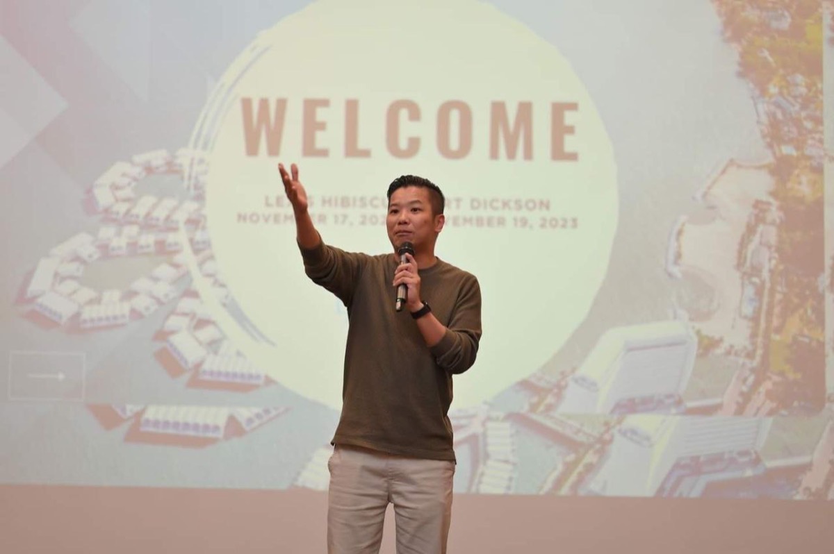 Mikael Chew welcoming an audience